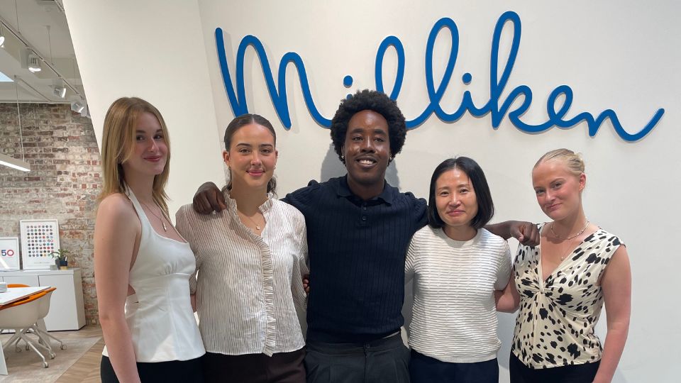 Milliken Design Competition Winners stood together smiling for a photograph